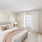 carpeted bedroom with window