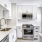 window brightens kitchen with light colored cabinets and countertops